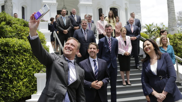 Deputy Premier Steven Miles wrangles his newly sworn-in cabinet colleagues for a selfie at Government House after the 2020 election. At least three faces will no longer feature after Friday.
