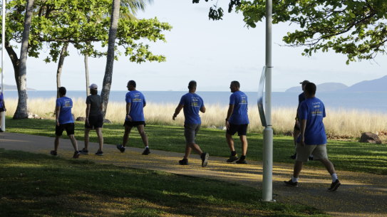 LNP leader Deb Frecklington walks along The Strand in Townsville with her local candidates 