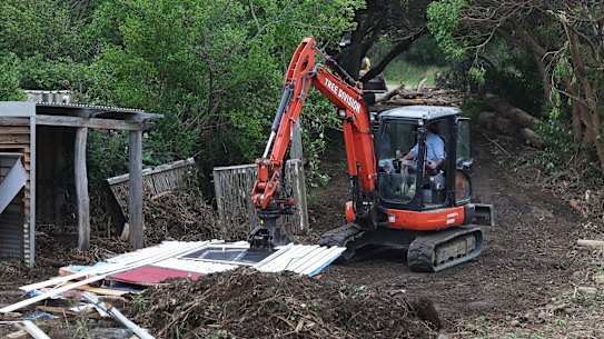After the flood: the cleanup underway at Separation Creek. 