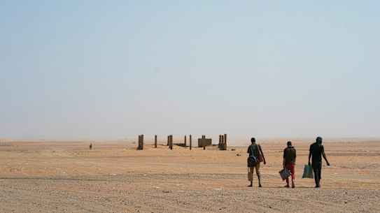 Men head north towards Algeria after crossing the Assamaka border post in northern Niger in 2018. More than 80 African migrants have been rescued in the desert, IOM said on Tuesday.