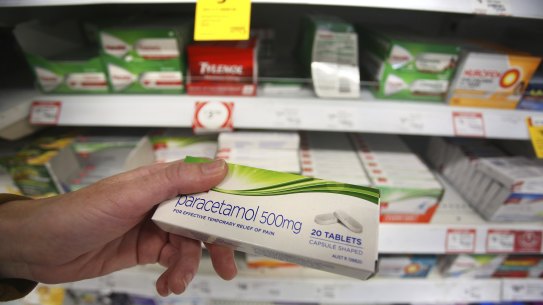 A customer inspects a box of Paracetamol tablets at a supermarket in Sydney. 