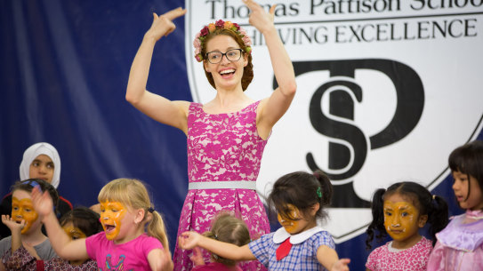 Emma Watkins using sign language at a visit to the Thomas Pattison Deaf School. 