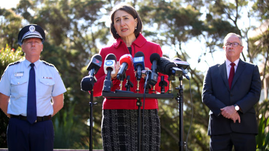 NSW Police Commissioner Mick Fuller with Premier Gladys Berejiklian and Health Minister Brad Hazzard on Monday