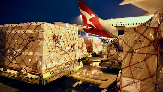 COVID-19 supplies for India being loaded into a Qantas plane on Wednesday.