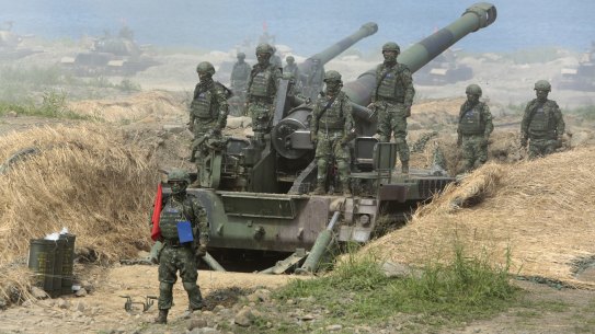 Taiwanese forces conducting an anti-invasion drill on a beach.