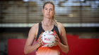 Former netball star and now sports journalist Caitlin Bassett says she was born a perfectionist.