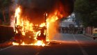 A bus goes up in flames during a protest against the Citizenship Amendment Act in New Delhi.