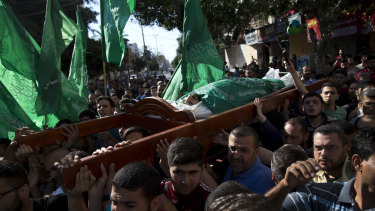 Palestinians carry the body of Mousab Abu Leila, 29, during his funeral after he was killed during Monday's protest on the border with Israel.