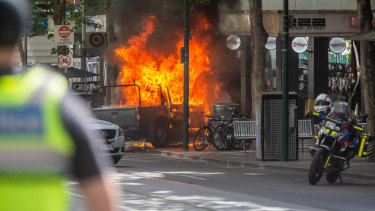 The moment the car burst into flames on Bourke Street.