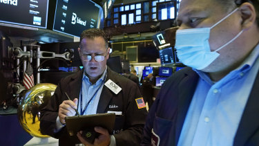 Wall Street was sharply lower at lunch but pared some of its losses in the afternoon.