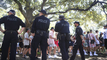 Police patrol outside Field Day at The Domain on New Year's Day.