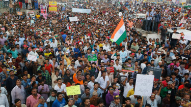 Men protest against the rapes in Ahmadabad on Wednesday.