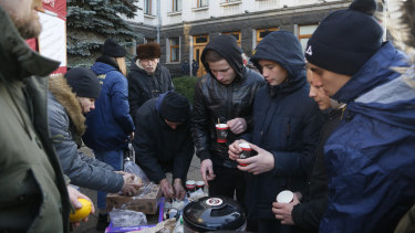 Ukrainian protesters camped out in front of their President's office in Kiev ahead of the long-awaited summit aiming to end the war with Russia.