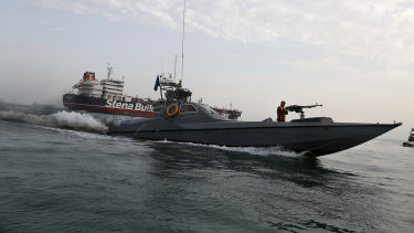A speedboat from Iran's Revolutionary Guard moves around British-flagged oil tanker Stena Impero, which was seized on Friday by the Guard in the Iranian port of Bandar Abbas.
