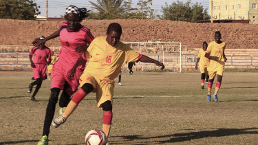 Sudanese al-Difaa, in pink, and al-Sumood women's teams play in Omdurman, Khartoum's twin city, Sudan. 