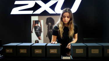 2XU shop assistant Cici Lawson preps the new Yeezy range at the 2XU flagship store on the morning of the collection's launch.