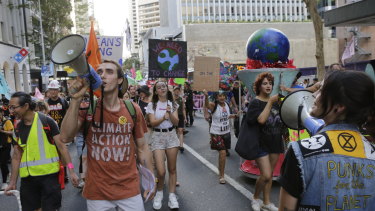 Protesters march through the city calling for more government action on climate change, including a net-zero emissions target by 2030.