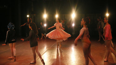 Young dancers, some from Venezuela, perform on stage during a rehearsal of Vladimir Issaev's rendition of The Nutcracker in Fort Lauderdale, Florida.