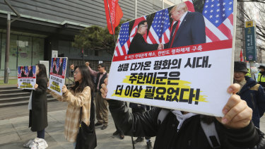 Protesters with banners of US President Donald Trump and North Korean leader Kim Jong-un stage a rally in Seoul, South Korea.