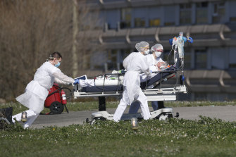 A COVID-19 patient is evacuated from the Mulhouse civil hospital in eastern France last week.