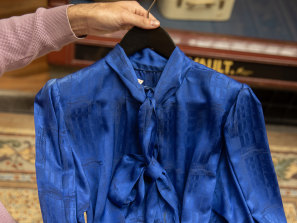 An Yves Saint Laurent blue satin blouse from the 1980s. 