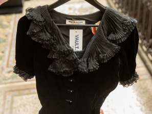 A small Saint Laurent Paris black velvet blouse with pleated neckline from the 1980s. 