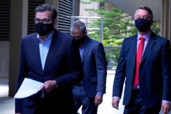 Premier Daniel Andrews, Chief Health Officer Brett Sutton and Health Minister Martin Foley arrive at Treasury Theatre on Tuesday.