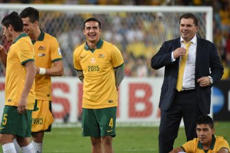 Cahill and Ange Postecoglou celebrate the Socceroosâ Asian Cup triumph in 2015.