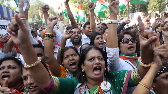 India's opposition Congress party supporters shout slogans during a protest against Electronic Voting Machines (EVM) in Mumbai on Wednesday. The protesters demanded that paper ballots be reintroduced for the upcoming general elections, scheduled for later this year. 