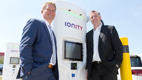 Dr Michael Hajesch, chief executive of IONITY and Dr David Finn, chief executive and co-founder of Tritium with a charging station in Germany. 
