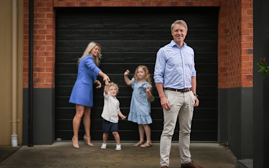 Arron Wood, at home with his wife Stephanie and their children Sam and Addison.