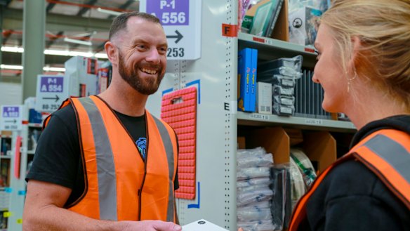 Bendigo Gaming Tech founder Tyler Swann looks at his products on the floor of Amazon's fulfilment centre in Dandenong South. 