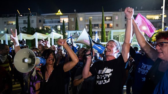 Israelis gather in a rally to support a unity government to oust Israeli Prime Minister Benjamin Netanyahu from office on Monday.