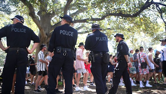 Police patrol outside Field Day at The Domain on New Year's Day.
