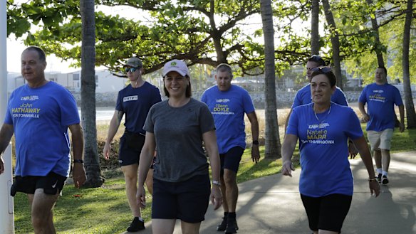 LNP leader Deb Frecklington and Townsville-region candidates walk along the Strand in week one of the campaign.
