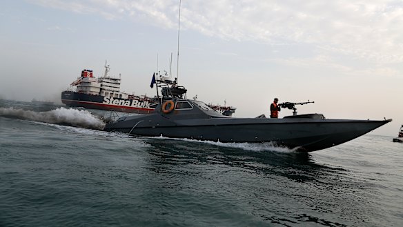 A speedboat from Iran's Revolutionary Guard moves around British-flagged oil tanker Stena Impero, which was seized in July.