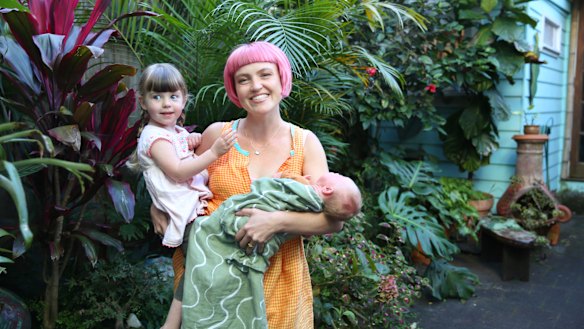 “I distinctly remember trying to push the pram into shops and just sweating and being like ‘I don’t know how to do this’,” says director Ruby Challenger, pictured here with daughters Scout and baby Lux.