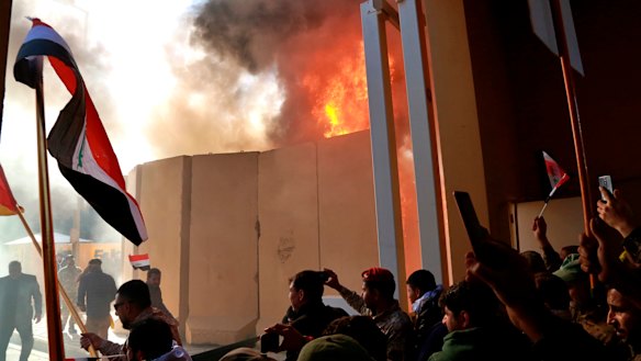 Protesters break into the US embassy compound, in Baghdad, Iraq, on Tuesday.