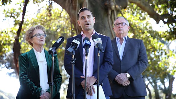 Independent MP Alex Greenwich announces the introduction of the bill, flanked by Wendy McCarthy and NSW Health Minister Bard Hazzard.