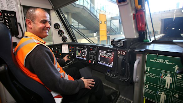 Train driver Adam Ghamrawi at the controls of a new Waratah train at Olympic Park.