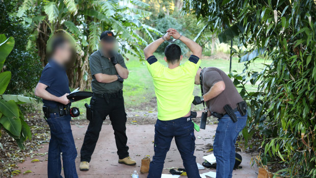 Police arrest one of their suspects in Atherton, QLD. 