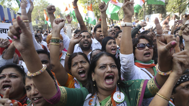 India's opposition Congress party supporters shout slogans during a protest against Electronic Voting Machines (EVM) in Mumbai on Wednesday. The protesters demanded that paper ballots be reintroduced for the upcoming general elections, scheduled for later this year. 