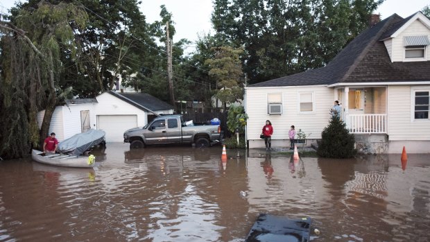 Residents are surrounded by floodwaters in the aftermath of Hurricane Ida in Manville, New Jersey.