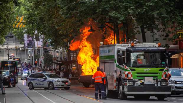 The scene in Bourke Street on Friday where Hassan Khalif Shire Ali was shot by police after setting a vehicle alight and stabbing multiple people.
