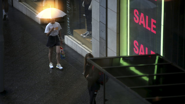 Umbrellas made a rare appearance in Sydney's east as light rain fell on Sunday.