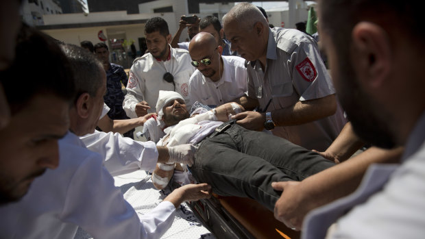 A Palestinian wounded during Monday's protest is brought to a hospital in Gaza City.