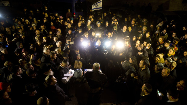 People attend the funeral of a baby who died after being prematurely delivered after her mother Shira Ish-Ran was wounded in attach in the West Bank.