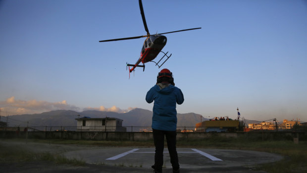 A helicopter carrying bodies of those killed in Gurja Himal mountain arrives at the Teaching hospital in Kathmandu.