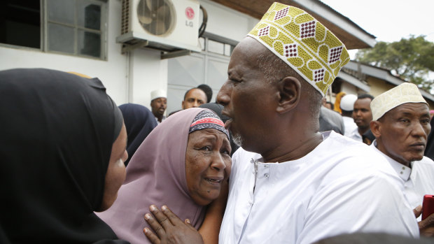 Mourners grieve as they prepare to pray over the bodies of victims  killed in Tuesday's attack on a luxury hotel and shopping complex in Nairobi. Al-Shabaab  claimed responsibility for the attack.