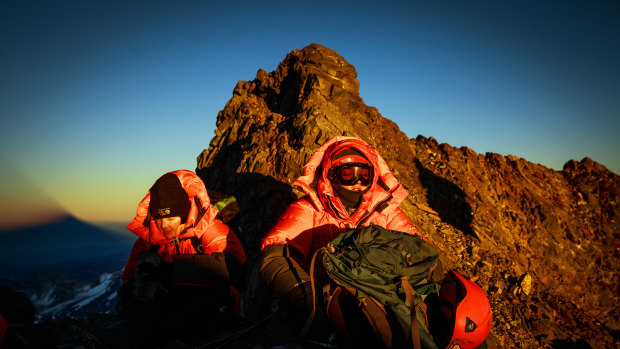 Isabella de la Houssaye, left, and her daughter Bella take a break at sunrise, just a few hours shy of the summit of Argentina's Aconcagua, the highest peak outside the Himalayas.